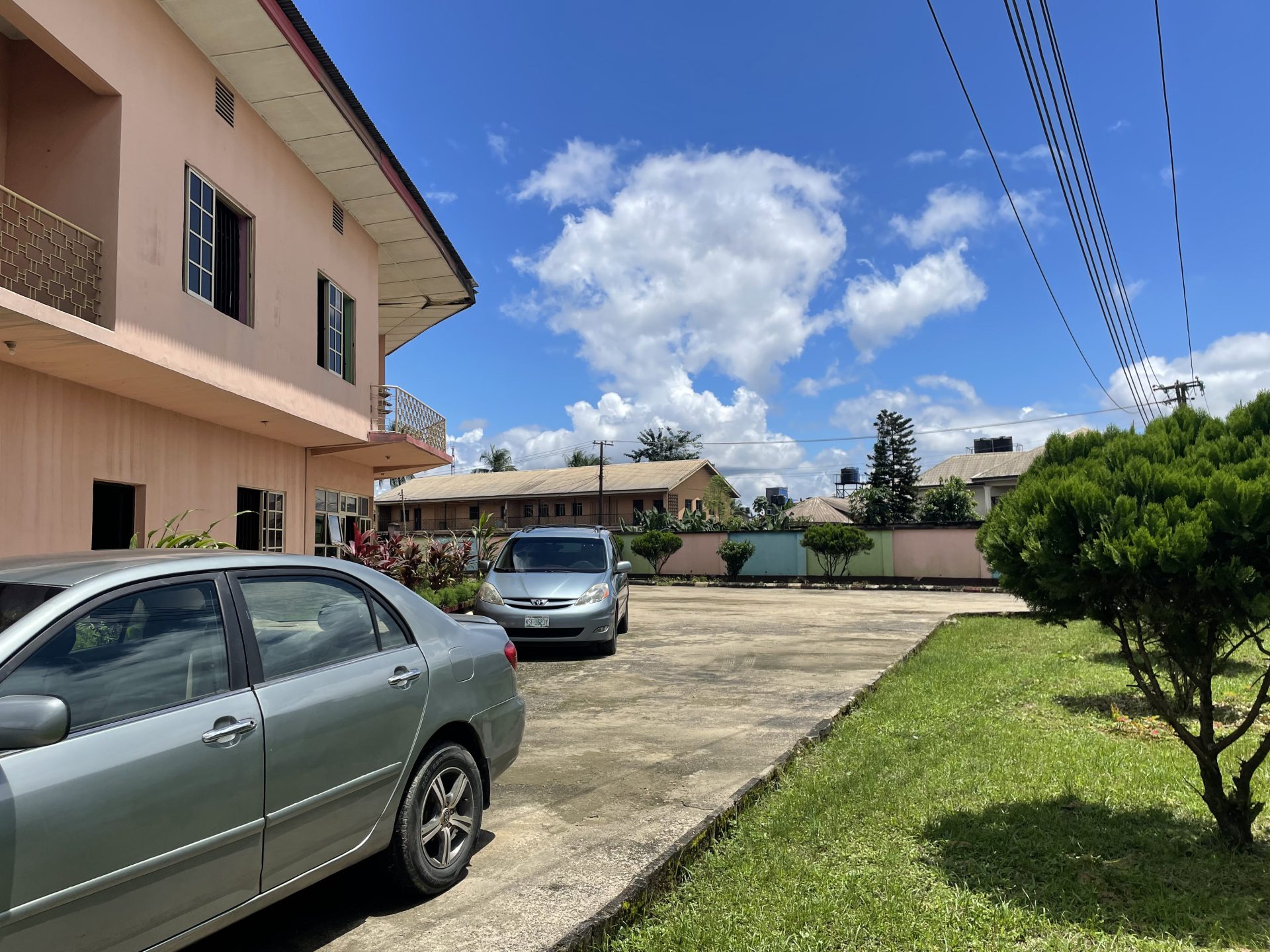 The school building and parking area at Royal Excellentia International School